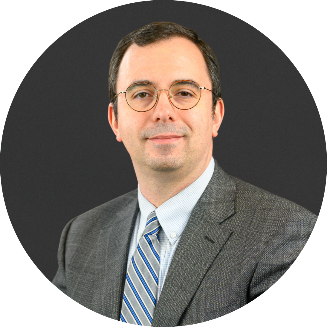 A headshot of Robert Misulich with a dark gray background.