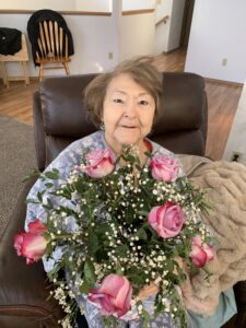 Emily Carlson holding flowers